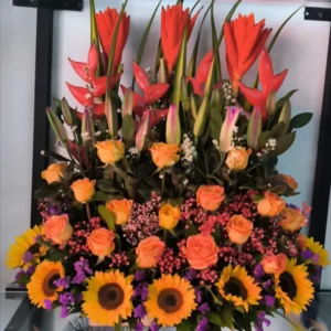 Atardecer Tropical – Arreglo de Girasoles, Rosas y Flores Tropicales